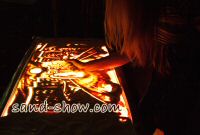 Live sand art